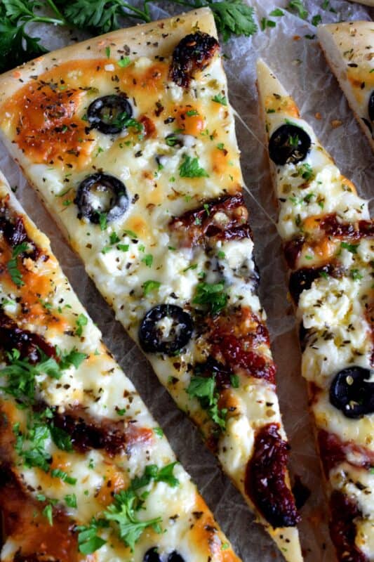 Fast, easy, and delicious Homemade Mediterranean Flatbread-style pizza in less than thirty minutes! Simply change the toppings to suit your preferences! #flatbread #pizza #Mediterranean #homemade #recipe