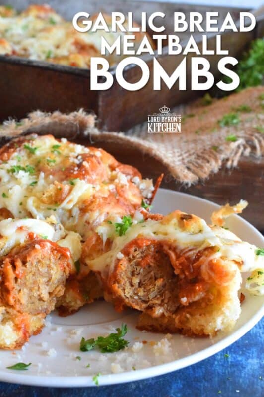 Garlic Bread Meatball Bombs are hollowed out dinner rolls which have been liberally smeared with homemade garlic butter. Each roll is stuffed with a meatball and sauce, then topped with cheese. Baked to a bubbling, gooey perfection, these bombs are the bomb! #meatballs #sliders #dinnerrollrecipes #bombs #meatballrecipes #familyrecipes #garlicbread