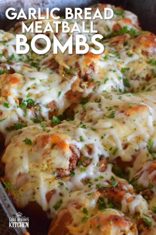 Garlic Bread Meatball Bombs are hollowed out dinner rolls which have been liberally smeared with homemade garlic butter. Each roll is stuffed with a meatball and sauce, then topped with cheese. Baked to a bubbling, gooey perfection, these bombs are the bomb! #meatballs #sliders #dinnerrollrecipes #bombs #meatballrecipes #familyrecipes #garlicbread