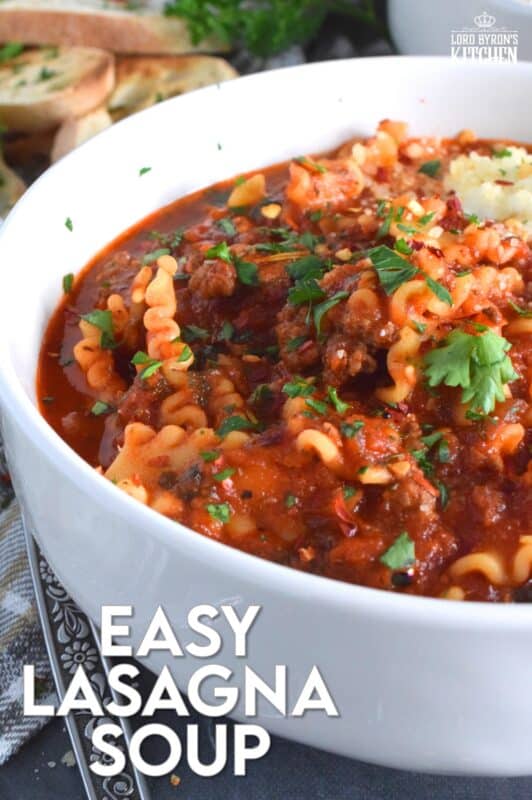 Hearty and beefy and topped with fresh mozzarella cheese, this Easy Lasagna Soup is a perfect meal for a chilly wintery night supper. Easy to prepare in about thirty minutes, and packed with familiar homestyle baked lasagna flavours. Kick it up a notch with a good sprinkling of chili flakes to add extra warmth and heat! #lasagna #soup #tomato #mozzarella #hearty #beef