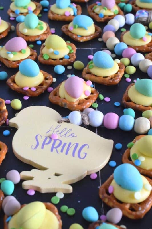Oftentimes, these types of snacks are prepared with a large chocolate center, but to keep these Chickadee Pretzel Snack Bites as Easter-like as possible, use a yellow candy melt wafer instead! Top them with a Cadbury Mini Egg and festive sprinkles! Not only are they super cute, but they're also super delicious! #easter #pretzel #treats #snacks