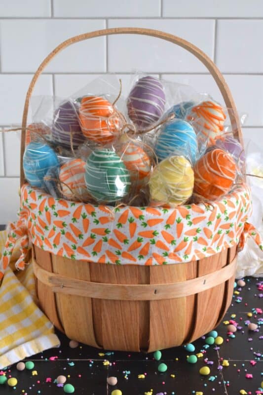Prepared with a homemade chocolate mini egg cake center, dipped in spring-like, pastel-coloured candy melts, and drizzled with melted white chocolate, Easter Mini Egg Cake Pops are fun to make and are super fun to eat too! So much cheaper than store-bought cake pops, these are almost too delicious to share! #easter #cakepops #minieggs