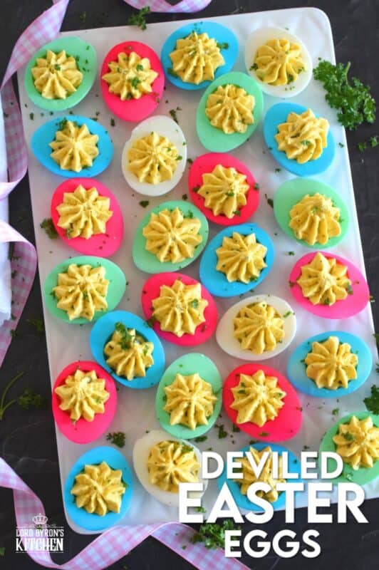Easter isn't Easter without boiled eggs, so why not have some fun and make a batch of very Easter-y and very colourful Deviled Easter Eggs!? Don't hide these around the house and give the Easter Bunny all the credit! #deviledeggs #eastereggs #easter #deviled #boiledeggs #dyedeggs