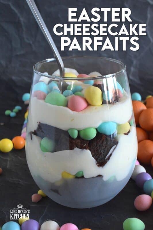 Crumbled brownies are layered with chocolate mini eggs and a homemade cream cheese filling in this Easter Cheesecake Parfait recipe. Easily prepare everything a few days ahead of time and assemble the parfaits when ready to serve. Make extra because these are deliciously addictive! #easter #dessert #parfait #brownie #minieggs