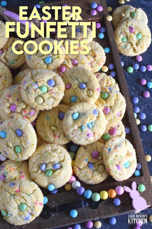 Candy-coated chocolate and pastel sprinkles are very popular when baking for Easter, especially if you're baking for kids!  However, the kids are going to have to share with the adults, because when it comes to these Easter Funfetti Cookies, they appeal to everyone! With a sweet, sugary coating, these soft and chewy cookies are loaded with lots of colour and flavour!  It's hard to eat just one of these! #easter #funfetti #candy #sprinkles #pastel #cookies