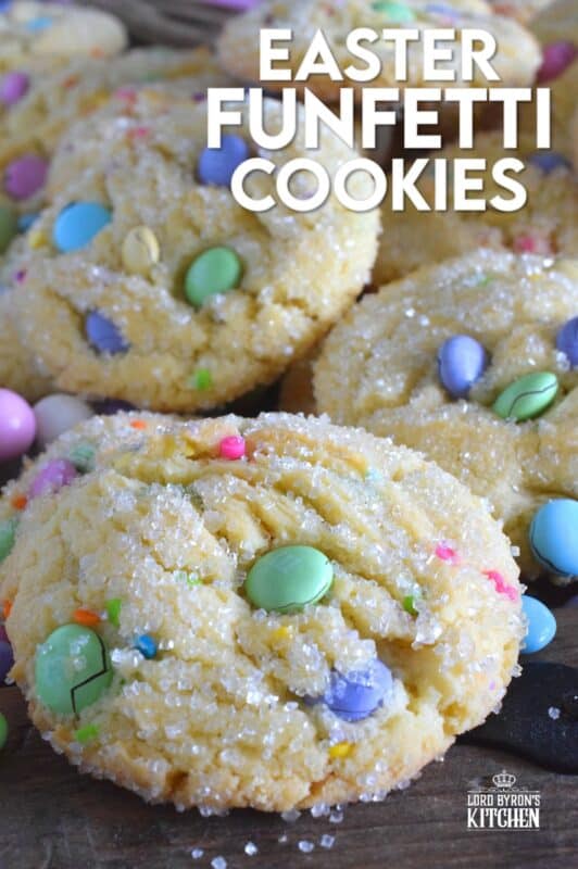 Candy-coated chocolate and pastel sprinkles are very popular when baking for Easter, especially if you're baking for kids!  However, the kids are going to have to share with the adults, because when it comes to these Easter Funfetti Cookies, they appeal to everyone! With a sweet, sugary coating, these soft and chewy cookies are loaded with lots of colour and flavour!  It's hard to eat just one of these! #easter #funfetti #candy #sprinkles #pastel #cookies