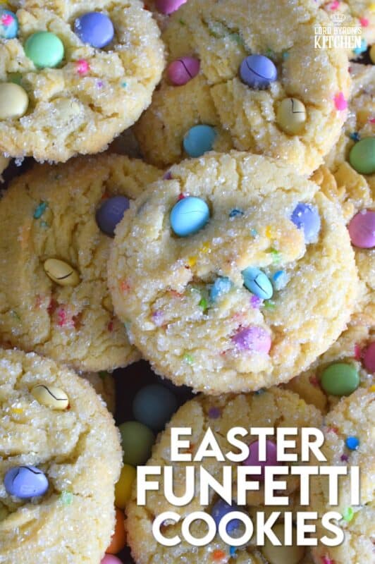 Candy-coated chocolate and pastel sprinkles are very popular when baking for Easter, especially if you're baking for kids!  However, the kids are going to have to share with the adults, because when it comes to these Easter Funfetti Cookies, they appeal to everyone! With a sweet, sugary coating, these soft and chewy cookies are loaded with lots of colour and flavour!  It's hard to eat just one of these! #easter #funfetti #candy #sprinkles #pastel #cookies