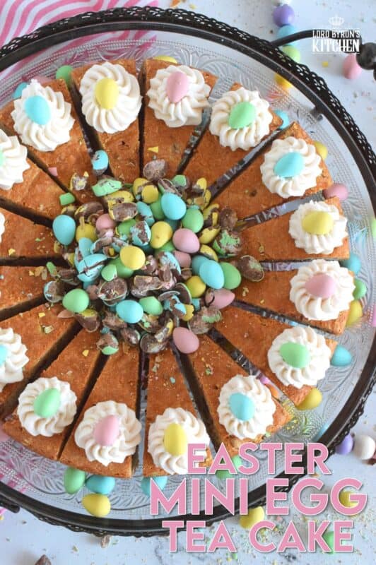 Prepared with crushed chocolate mini eggs and topped with a dollop of buttercream frosting, this Easter Mini Egg Tea Cake looks quite delicious and inviting! Keep the decorating simple with a pile of mini eggs right in the center and let the cake speak for itself! A delightful treat, this cake is a beautiful Easter dessert! #minieggs #easter #cadbury #cake #teacake