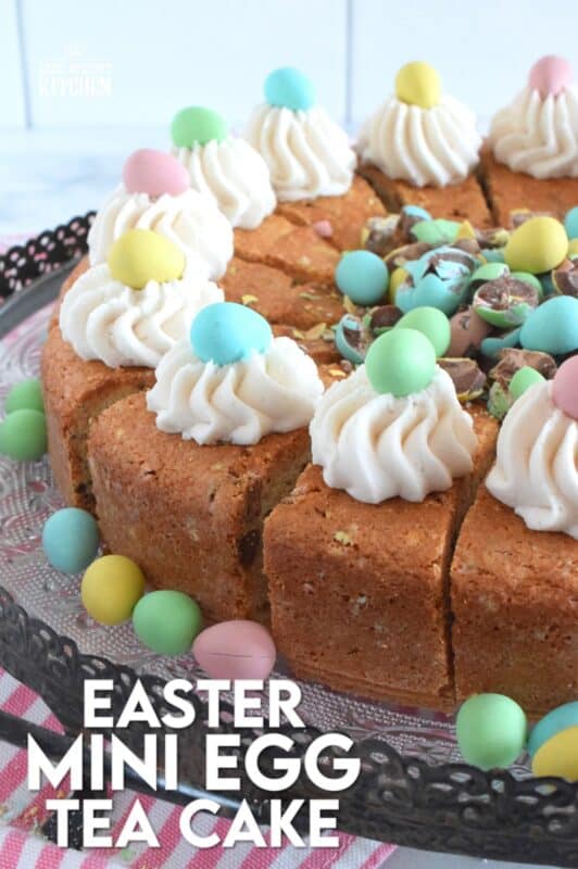 Prepared with crushed chocolate mini eggs and topped with a dollop of buttercream frosting, this Easter Mini Egg Tea Cake looks quite delicious and inviting! Keep the decorating simple with a pile of mini eggs right in the center and let the cake speak for itself! A delightful treat, this cake is a beautiful Easter dessert! #minieggs #easter #cadbury #cake #teacake