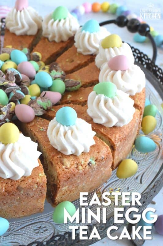Prepared with crushed chocolate mini eggs and topped with a dollop of buttercream frosting, this Easter Mini Egg Tea Cake looks quite delicious and inviting! Keep the decorating simple with a pile of mini eggs right in the center and let the cake speak for itself! A delightful treat, this cake is a beautiful Easter dessert! #minieggs #easter #cadbury #cake #teacake