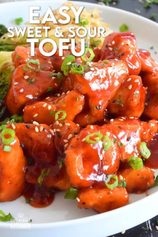 Extra firm tofu is seasoned and baked until lightly crispy on the outside with a slightly chewy, meatier inside. It is then tossed in a homemade sweet and sour sauce which makes this one of the most delicious ways to enjoy a baked tofu dish! If you think you don't like tofu, you obviously have not tried this recipe! #tofu #sweetandsour #meatless