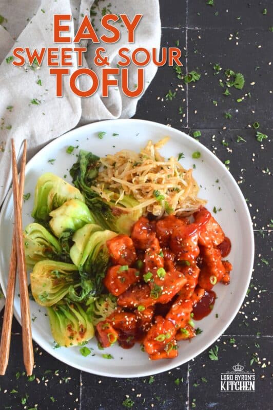 Extra firm tofu is seasoned and baked until lightly crispy on the outside with a slightly chewy, meatier inside. It is then tossed in a homemade sweet and sour sauce which makes this one of the most delicious ways to enjoy a baked tofu dish! If you think you don't like tofu, you obviously have not tried this recipe! #tofu #sweetandsour #meatless