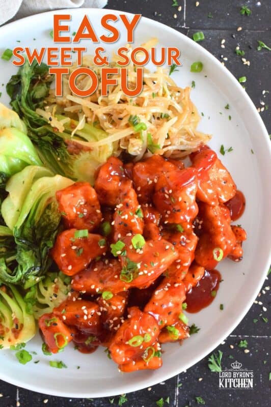 Extra firm tofu is seasoned and baked until lightly crispy on the outside with a slightly chewy, meatier inside. It is then tossed in a homemade sweet and sour sauce which makes this one of the most delicious ways to enjoy a baked tofu dish! If you think you don't like tofu, you obviously have not tried this recipe! #tofu #sweetandsour #meatless
