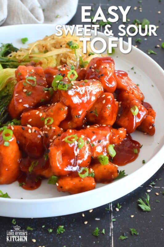 Extra firm tofu is seasoned and baked until lightly crispy on the outside with a slightly chewy, meatier inside. It is then tossed in a homemade sweet and sour sauce which makes this one of the most delicious ways to enjoy a baked tofu dish! If you think you don't like tofu, you obviously have not tried this recipe! #tofu #sweetandsour #meatless