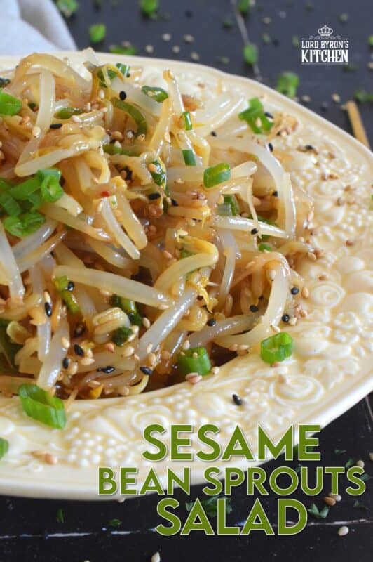 Served warm or cold, Sesame Bean Sprouts Salad is a crunchy and delicious side that can be prepared in less than 10 minutes! Blanched sprouts are tossed in a savoury, earthy, salty sauce made with soy sauce, sesame oil, minced garlic, and lots of fresh green onions. #beansprouts #salad #sesame