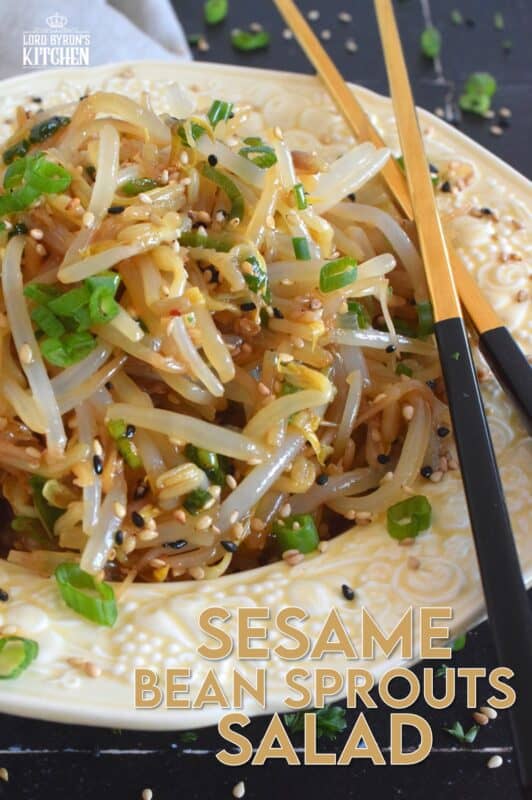 Served warm or cold, Sesame Bean Sprouts Salad is a crunchy and delicious side that can be prepared in less than 10 minutes! Blanched sprouts are tossed in a savoury, earthy, salty sauce made with soy sauce, sesame oil, minced garlic, and lots of fresh green onions. #beansprouts #salad #sesame