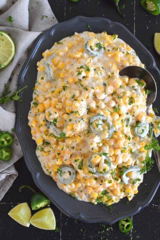 This delicious, rich, comforting side is prepared with fresh jalapenos, frozen corn, and cream cheese.  Jalapeno Popper Creamed Corn is not only quick and easy to prepare, but it is also an excellent topping for many of your favourite mains like tacos!  Super cream, super cheesy, and super tasty! #jalapeno #poppers #creamedcorn #sidedish