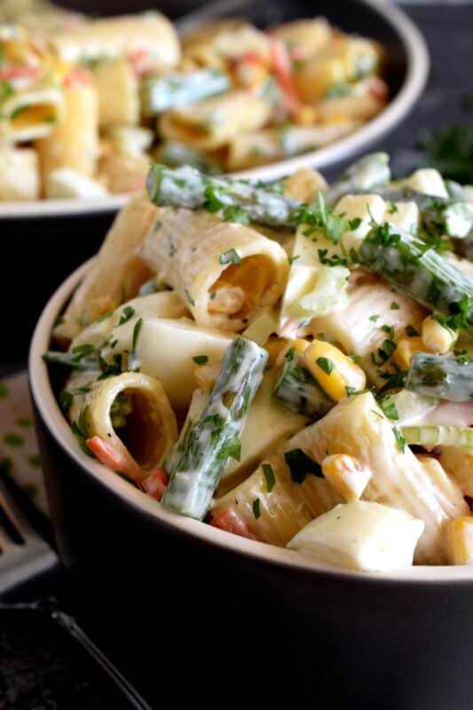 Served cold or at room temperature, Asparagus and Egg Pasta Salad is a dish best served in late spring or early summer when fresh asparagus is readily available. Bring this dish to your next picnic or potluck and you'll surely be the belle of the ball! #asparagus #egg #salad #pasta #fresh #picnic #summer #potluck
