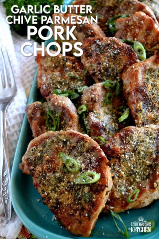 Using thin, boneless pork chops to keep the baking time quick, these chops are prepared with fresh garlic, salted butter, chopped chives, and freshly grated parmesan cheese. They are so simple, yet deliciously impressive! #porkchops #garlic #parmesan #fastfry