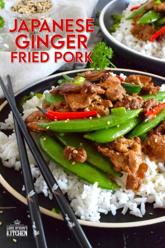 Marinate the pork ahead of time and prepare dinner in about ten minutes flat with this Japanese Ginger Fried Pork recipe.  Made with red bell peppers and snow peas, serve over steamed rice for a completely nutritious meal! #pork #japanese #asianfood #stirfry #ginger