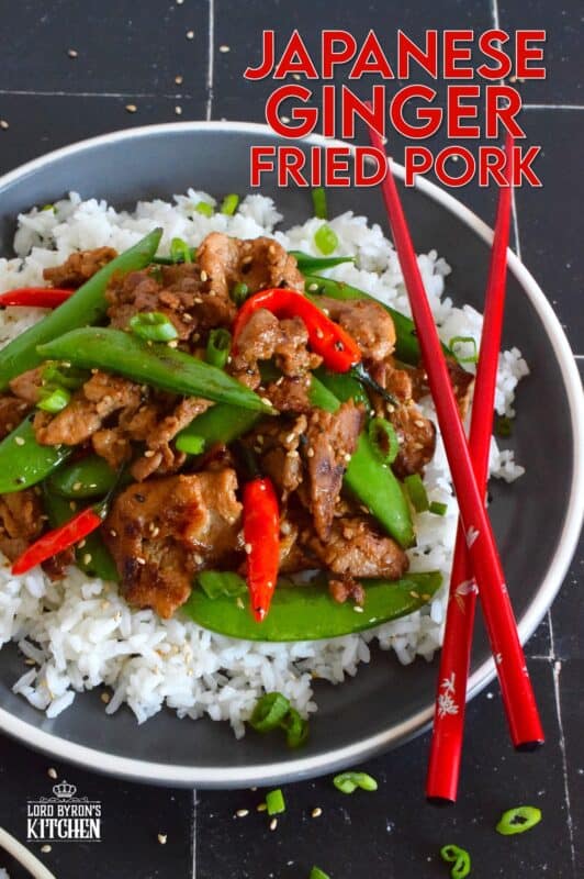 Marinate the pork ahead of time and prepare dinner in about ten minutes flat with this Japanese Ginger Fried Pork recipe.  Made with red bell peppers and snow peas, serve over steamed rice for a completely nutritious meal! #pork #japanese #asianfood #stirfry #ginger