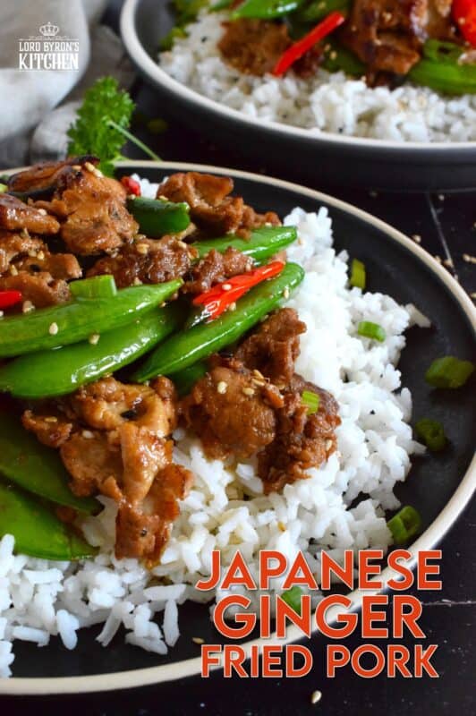 Marinate the pork ahead of time and prepare dinner in about ten minutes flat with this Japanese Ginger Fried Pork recipe.  Made with red bell peppers and snow peas, serve over steamed rice for a completely nutritious meal! #pork #japanese #asianfood #stirfry #ginger