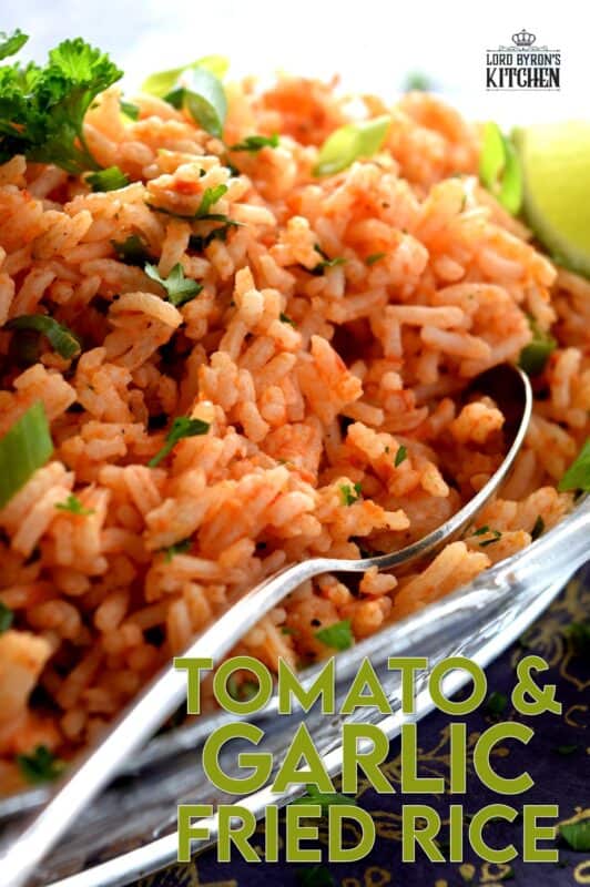A fast and delicious side dish using leftover rice! Tomato and Garlic Fried Rice is prepared with a hint of fresh lime, and the rustic flavours of onions, garlic, and tomatoes, this dish is sure to bring much needed life to any plate! #friedrice #rice #garlicky #leftover #sidedish