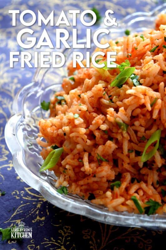 A fast and delicious side dish using leftover rice! Tomato and Garlic Fried Rice is prepared with a hint of fresh lime, and the rustic flavours of onions, garlic, and tomatoes, this dish is sure to bring much needed life to any plate! #friedrice #rice #garlicky #leftover #sidedish