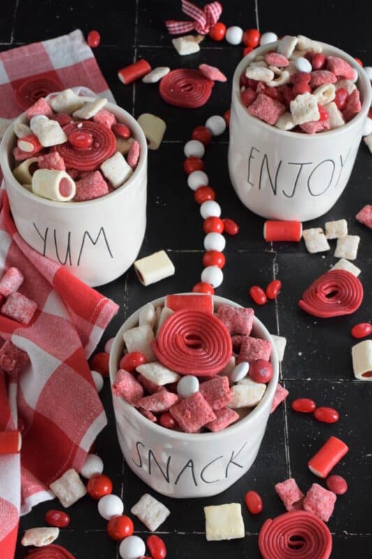 Assemble this Canadian Red and White Snack Mix and serve it to your guests this Canada Day long weekend! Loaded with sugary treats, this snack mix will disappear quite quickly! Friends can help themselves to a tasty treat at your party, or scoop some into cellophane bags and tie them up with a festive ribbon as a take-home treat! #snackmix #canadaday #redandwhite