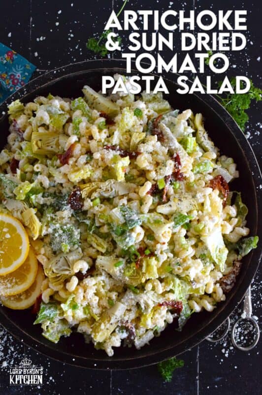 Prepared with pasta, lettuce, canned artichokes, chopped sun-dried tomatoes, onions, and parmesan, this salad can be a delicious side or a complete meal! The hot and hazy days of summer are just weeks away, so save this recipe now for your backyard barbecues and those family picnics! #sundried #tomato #pasta #salad #artichoke