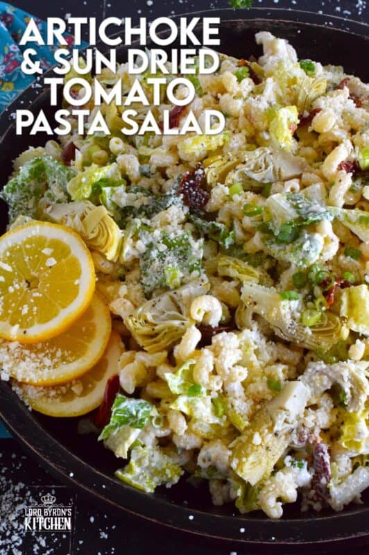 Prepared with pasta, lettuce, canned artichokes, chopped sun-dried tomatoes, onions, and parmesan, this salad can be a delicious side or a complete meal! The hot and hazy days of summer are just weeks away, so save this recipe now for your backyard barbecues and those family picnics! #sundried #tomato #pasta #salad #artichoke