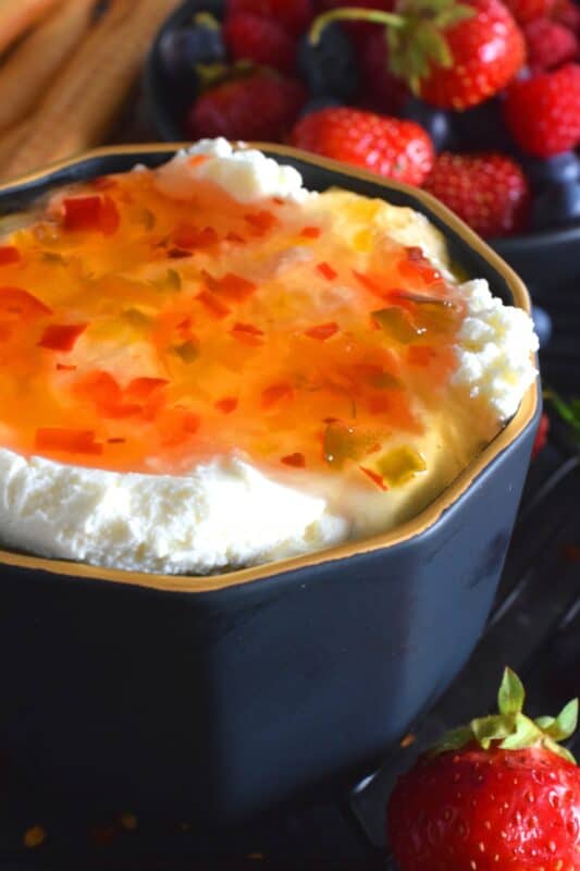 Possibly considered to be more of an appetizer or a dip, Hot Sweet Pepper Jelly is easy to prepare and makes for a quick and easy appetizer or ingredient. These are canned using the water bath canning method, which couldn't be easier! This post will walk you through every step. #hotpepperjelly #hotandsweet #sweetpeppers #canning #preserves #jelly #cannedjelly