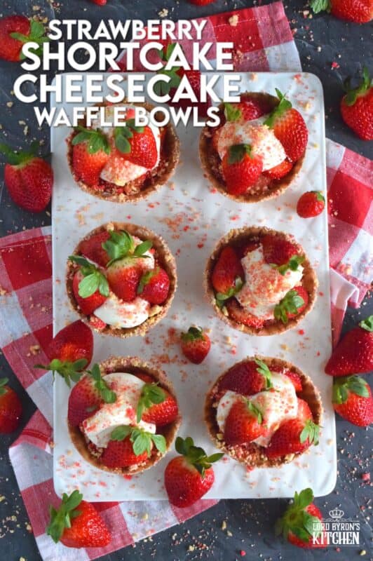 Sugary sweet and crunchy waffle bowls are coated with strawberry shortcake crumbs and filled with a light and fluffy cheesecake mixture, topped with fresh strawberries, and more strawberry shortcake crumbs. This gorgeously impressive dessert is for the serious strawberry lover! #shortcake #waffle #strawberry #cheesecake