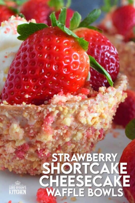 Sugary sweet and crunchy waffle bowls are coated with strawberry shortcake crumbs and filled with a light and fluffy cheesecake mixture, topped with fresh strawberries, and more strawberry shortcake crumbs. This gorgeously impressive dessert is for the serious strawberry lover! #shortcake #waffle #strawberry #cheesecake