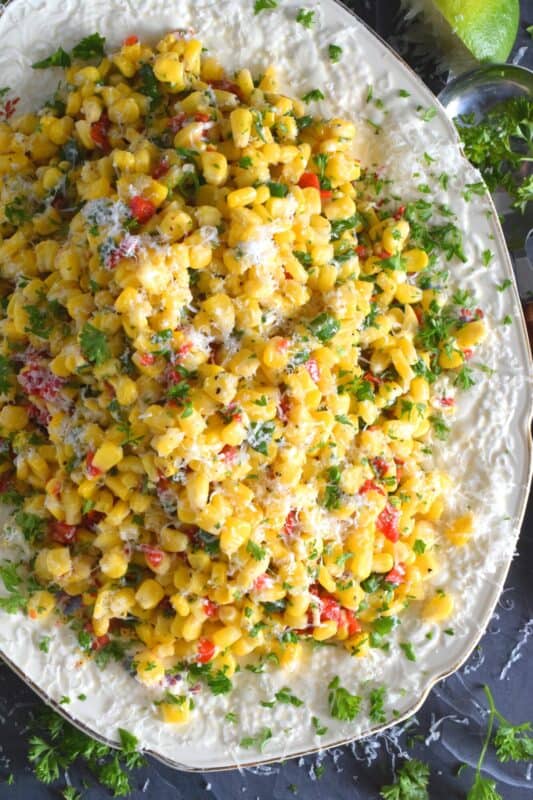 Combine sweet corn with roasted red peppers, green onions, freshly squeezed lime juice, and a good sprinkling of cotija cheese to get the most amazingly delicious summer salad. Serve at room temperature or slightly warmed to taste the optimum flavour profile. #sweet #cotija #corn #salad #lime #spicy