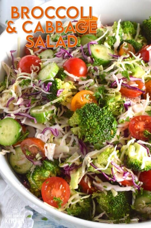 This salad is as fresh and as crisp as a salad can be! Loaded with both red and green cabbage, broccoli florets, tomatoes, and cucumbers, and tossed with an oil and vinegar dressing, this salad is light, healthy, and colourful. Perfect as a summer side, great for picnics, and can be made ahead of time too! #cabbage #salad #broccoli #side #summer #vinaigrette