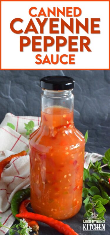 This hot and spicy sauce is not super hot, especially not in smaller amounts. Making good use of the last of the peppers before the frost hits is what this recipe was made for. Flecked with both red and green chilies, this sauce has so many uses! Prepared with vinegar, garlic, sugar, and salt, the flavour profile is complex and layered! #cayenne #pepper #sauce #canning #waterbath