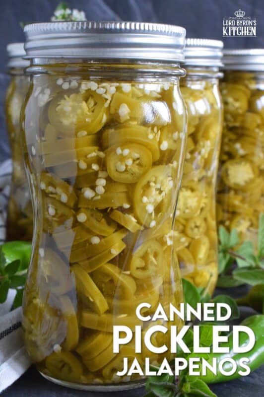 Pair these Canned Pickled Jalapenos with sandwiches, pizza, nachos, burgers, and even scrambled eggs! All you need to prepare these are jalapenos, white vinegar, salt, and water! Easily double or even triple the recipe and stock your canning pantry with these delicious hot and spicy morsels! #pickled #jalapenos