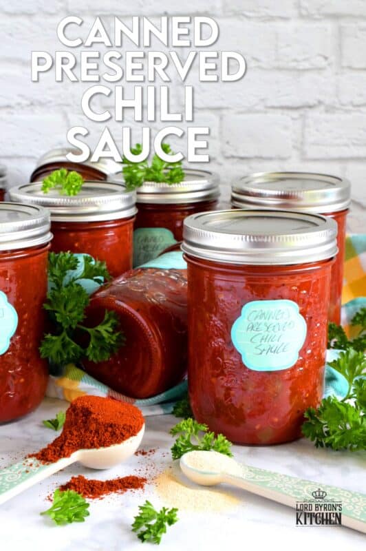 Always have a great tasting chili with deep flavour on hand with this Canned Chili Sauce recipe. Just add beans and simmer! But, that's not all; heat the sauce and ladle it over baked potato, or over fries topped with shredded cheese. So many possibilities when you have pantry stocked with this sauce! #canned #preserved #chili #sauce #tomatoes