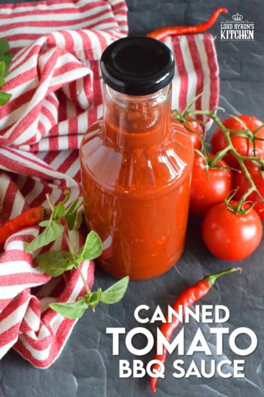 This tomato-based BBQ sauce has so much flavour! It is prepared with tomatoes, onions, bell peppers, garlic, and a hot chili or two if you like it spicy. Process in a water bath canner and stock your pantry with what is about to become your new favourite condiment! #bbq #sauce #canning #tomatoes