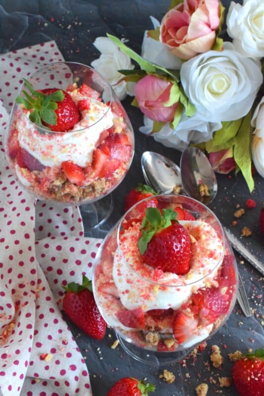This beautifully presented dessert is exceptionally easy to prepare. Layered with granola, yogurt, and fresh strawberries, is a homemade strawberry shortcake crumb mixture that is the star of this simply refreshing summertime dessert. It's a healthy alternative with just the right amount of indulgence! #strawberries #shortcake #parfait #crumbs