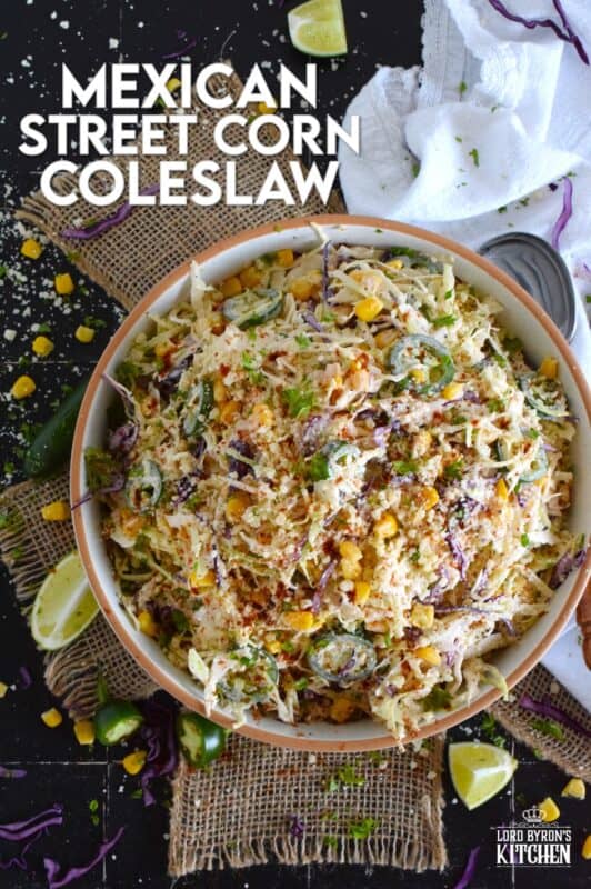 Crisp red and green cabbage, sweet corn, spicy jalapenos, fresh green onions, and salty cotija cheese all meet in the middle to create this most delicious Mexican Street Corn Coleslaw. With its creamy, zingy, and tart dressing, this coleslaw will most definitely please the toughest critic! #mexican #streetcorn #coleslaw #salad