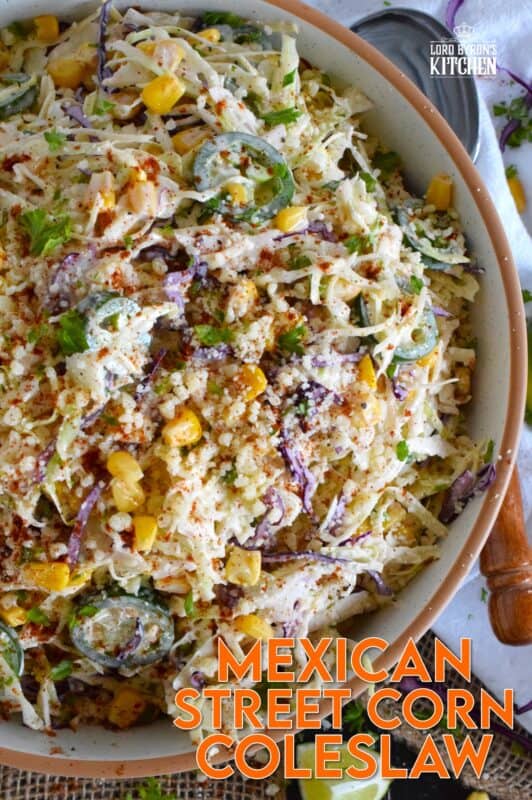 Crisp red and green cabbage, sweet corn, spicy jalapenos, fresh green onions, and salty cotija cheese all meet in the middle to create this most delicious Mexican Street Corn Coleslaw. With its creamy, zingy, and tart dressing, this coleslaw will most definitely please the toughest critic! #mexican #streetcorn #coleslaw #salad
