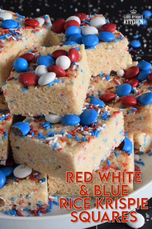 Everyone's favourite treat, these Rice Krispie Squares are loaded with red, white, and blue candy-coated chocolates as well as festive sprinkles. Easy to prepare and fun to eat, these can be prepared with regular or vegan marshmallows if you have any dietary restrictions. #4thofjuly #redwhiteandblue #ricekrispies #treats #squares #dandies