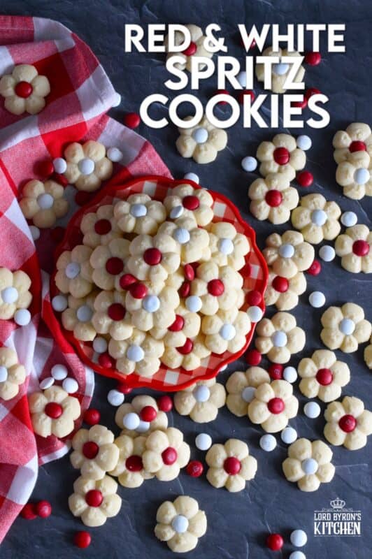 This recipe combines two very popular types of cookies – a spritz cookie and a thumbprint cookie! The base is slightly sweet and buttery and is perfectly paired with a single candy-coated chocolate. These are slightly crumbly, but not dry, and paired with a red or white M&M candy, these cookies are delicious! #redandwhite #canadaday #cookies #spritz