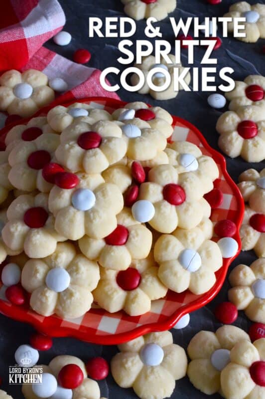 This recipe combines two very popular types of cookies – a spritz cookie and a thumbprint cookie! The base is slightly sweet and buttery and is perfectly paired with a single candy-coated chocolate. These are slightly crumbly, but not dry, and paired with a red or white M&M candy, these cookies are delicious! #redandwhite #canadaday #cookies #spritz
