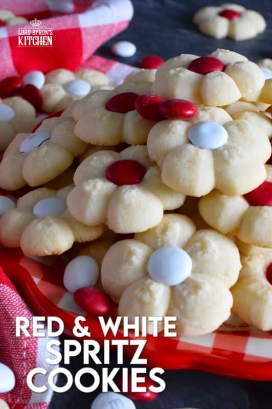 This recipe combines two very popular types of cookies – a spritz cookie and a thumbprint cookie! The base is slightly sweet and buttery and is perfectly paired with a single candy-coated chocolate. These are slightly crumbly, but not dry, and paired with a red or white M&M candy, these cookies are delicious! #redandwhite #canadaday #cookies #spritz