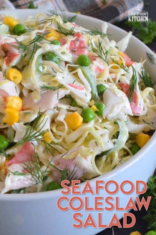 Chunks of crab and lobster are tossed with lots of fresh vegetables, like cabbage, cucumber, corn, peas, and green onions in a homemade creamy, tangy, and savoury dressing. Consider your budget and use real seafood or imitation crab and lobster to make this absolutely refreshing Seafood Coleslaw Salad! #seafood #salad #coleslaw #imitation #crab #lobster