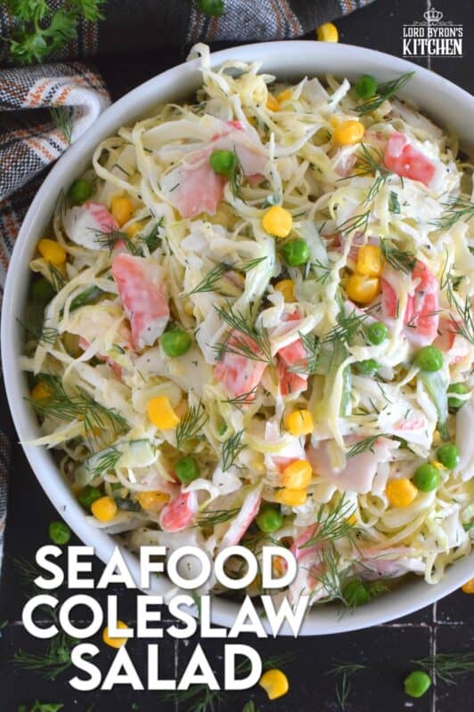 Chunks of crab and lobster are tossed with lots of fresh vegetables, like cabbage, cucumber, corn, peas, and green onions in a homemade creamy, tangy, and savoury dressing. Consider your budget and use real seafood or imitation crab and lobster to make this absolutely refreshing Seafood Coleslaw Salad! #seafood #salad #coleslaw #imitation #crab #lobster