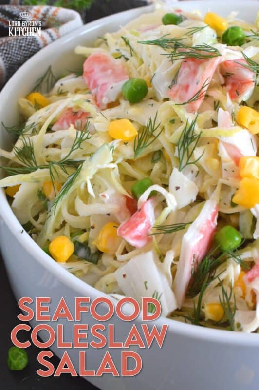 Chunks of crab and lobster are tossed with lots of fresh vegetables, like cabbage, cucumber, corn, peas, and green onions in a homemade creamy, tangy, and savoury dressing. Consider your budget and use real seafood or imitation crab and lobster to make this absolutely refreshing Seafood Coleslaw Salad! #seafood #salad #coleslaw #imitation #crab #lobster